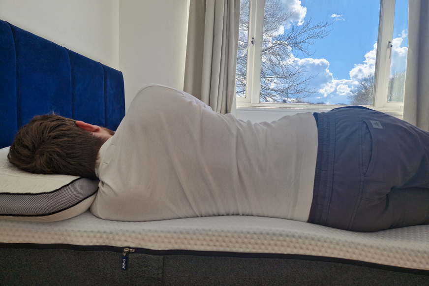 man sleeping on emma premium